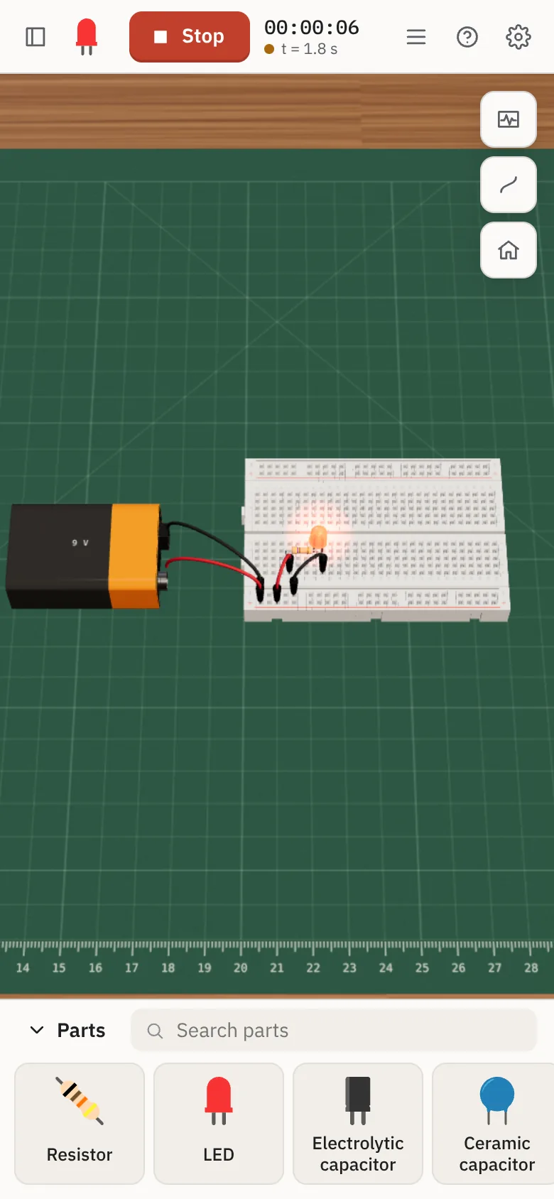 Breadboard Simulator on a phone, with the LED lit and the parts drawer below
